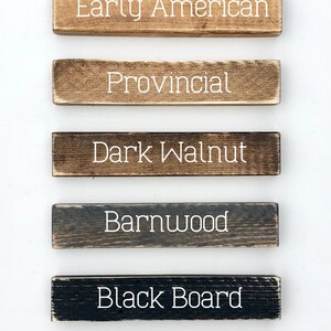 May include: Six wooden sign samples showing different frame choices: Early American, Provincial, Dark Walnut, Barnwood, Black Board, and Whitewash.