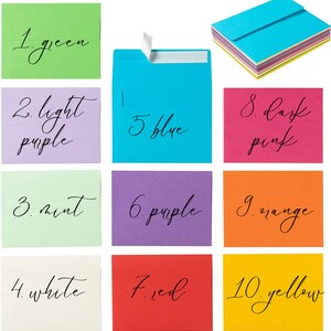 May include: A collection of colorful envelopes in various shades, including green, light purple, mint, white, blue, purple, red, dark pink, orange, and yellow. Each envelope has a number and color name written in black script.