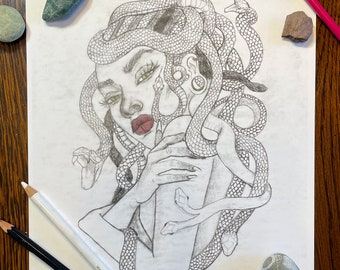 May include: A black and white pencil drawing of Medusa, a mythical Greek figure with snakes for hair, holding a glass of liquid. The drawing is on white paper.