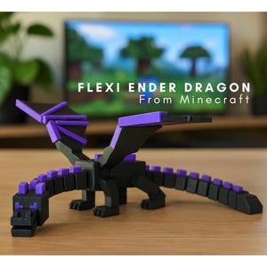 May include: A black and purple Flexi Ender Dragon from Minecraft, displayed on a wooden surface. The dragon has articulated joints and is made of plastic. The text "FLEXI ENDER DRAGON From Minecraft" is visible in the background.