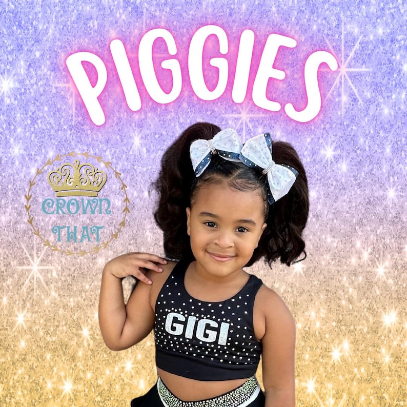 May include: A black crop top with white polka dots and the name GIGI in silver glitter text, paired with two large white and black patterned hair bows. The background features the text PIGGIES and a crown logo with the text CROWN THAT.