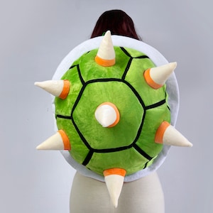 Green turtle shell backpack with white spike