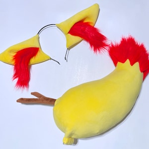May include: A yellow and red plush tail with a brown stick attached, and a yellow headband with red fur ear accents.