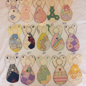 Quilted handmade angel ornaments made from repurposed vintage quilts that were unrepairable.