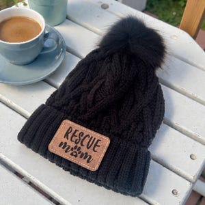 Personalized Black Beanie with Pom Pom, Laser Engraved Leather Patch, Rescue Mom Hat, Dog Lover Winter Beanie
