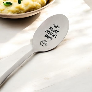 May include: A silver spoon with the text "Dad's Mashed Potatoes Spoon" engraved on it. A small illustration of a bowl of mashed potatoes is also engraved on the spoon.