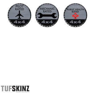 May include: Three round, silver-colored stickers with black borders and white text. The stickers feature a plane, a wrench, and a red cross with a snake wrapped around it. Each sticker says "Rated" and "4x4" in white text.