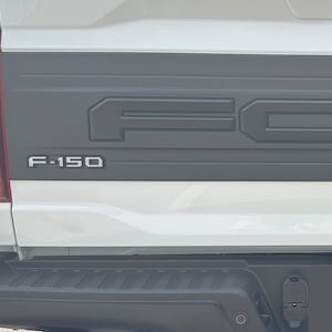 Tufskinz | F-150 Tailgate Emblem Overlays - Fits 2021-2025 F-150 Raptor, King Ranch, Limited, or Platinum Trim Levels - 5 Piece Kit