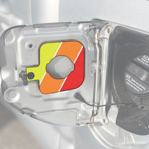 Tufskinz | Gas Cap Holder Fits 2005-2015 Tacoma - 1 Piece Kit