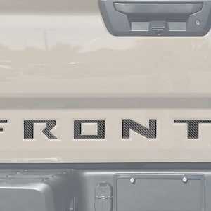 Tufskinz | Inserções de letras para porta traseira - Serve para Nissan Frontier 2022-2025 - Kit de 8 peças