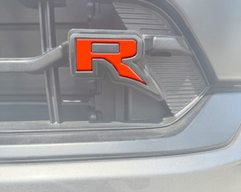 Tufskinz | Raptor "R" Grille Emblem Insert - Fits 2022-2026 F-150 Raptor - 1 Piece Kit