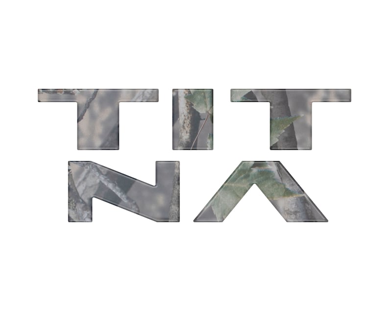 May include: The word "TITNA" in a camouflage pattern font.