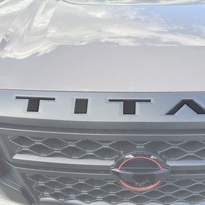 Tufskinz |  Grille Letter Inserts - Fits 2022-2025 Nissan Titan - 5 Piece Kit