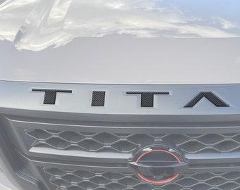 Tufskinz |  Grille Letter Inserts - Fits 2022-2026 Nissan Titan - 5 Piece Kit