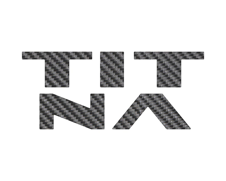 May include: A black and white logo with the word "TITAN" in a carbon fiber pattern.