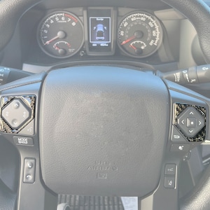 Tufskinz | Steering Wheel Upper Button Overlay - Fits 2016-2023 Tacoma - 2 Piece Kit