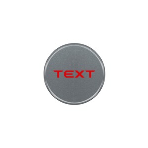 May include: A round, silver-colored button with the word "TEXT" printed in red.