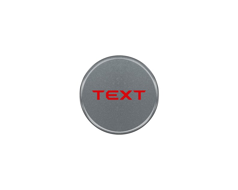 May include: A round, silver-colored button with the word "TEXT" printed in red.