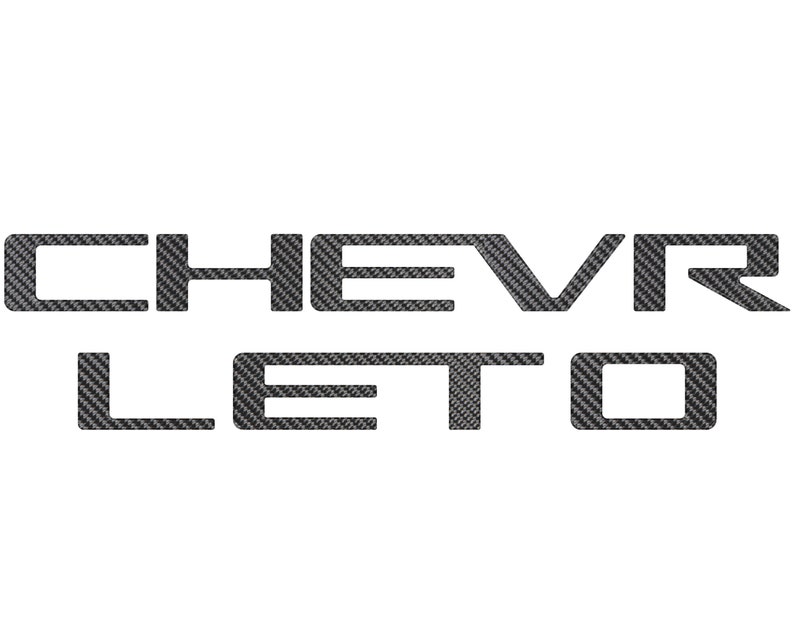 May include: A black and white carbon fiber decal with the text "CHEVROLET" in a bold, sans-serif font.