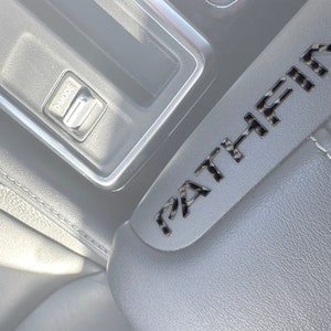 Tufskinz |  Center Console Lid Letter Inserts - Fits 2022-2025 Nissan Pathfinder - 10 Piece Kit