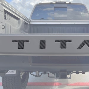 Tufskinz |  Tailgate Top Emblem Letter Inserts - Fits 2022-2025 Nissan Titan - 5 Piece Kit
