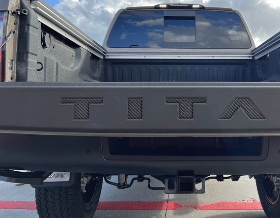 Nissan titan sale tailgate emblem