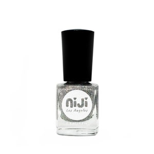 May include: A silver glitter nail polish bottle with a black cap. The bottle has a white label with the text "niji Los Angeles" and a small heart design.