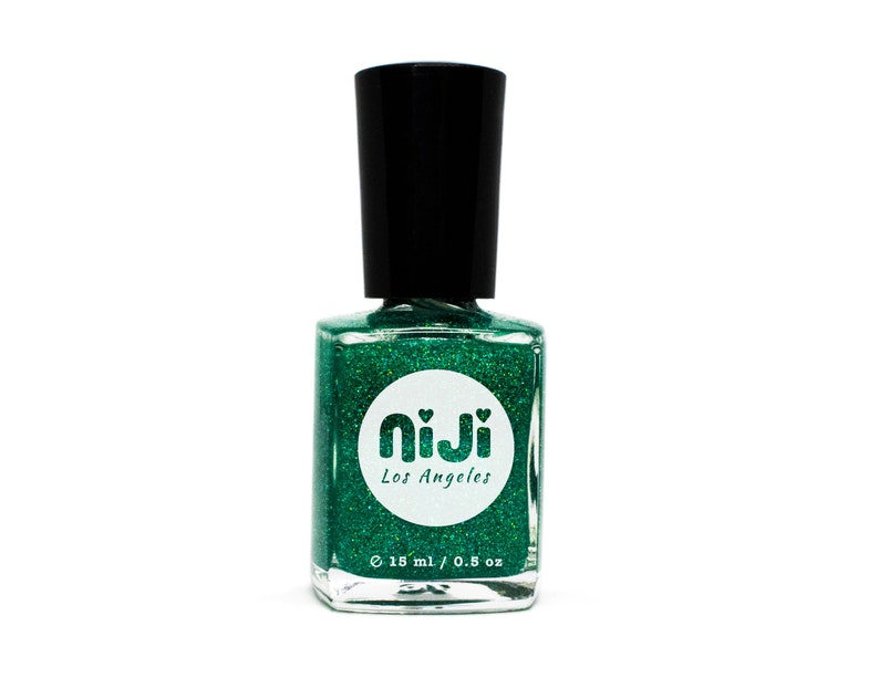 May include: A bottle of green glitter nail polish with a white circle label that says "niji Los Angeles" and "18 ml / 0.8 oz."