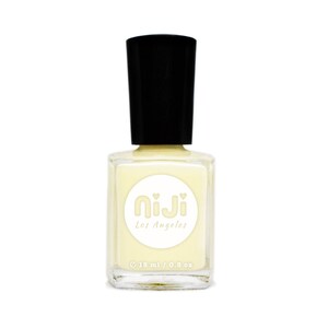 May include: A bottle of pale yellow nail polish with a black cap. The bottle has a white label with the text "Niji Los Angeles" and "15 ml / 0.5 oz".