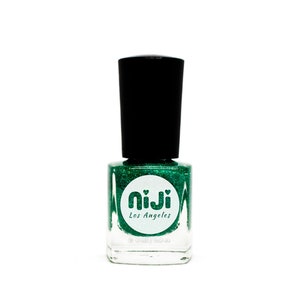 May include: A bottle of green glitter nail polish with a white label that says "niji Los Angeles".