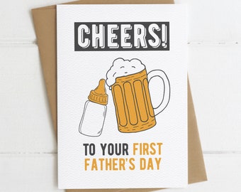 May include: A white card with black text that reads "CHEERS!" and "TO YOUR FIRST FATHER'S DAY". An illustration of a beer mug and a baby bottle are on the card.