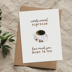 May include: A white card with the text "words cannot espresso how much you bean to me" and a watercolor illustration of a cup of coffee.