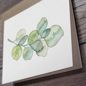 May include: A watercolor painting of a eucalyptus branch with green leaves. The leaves are painted in a light and airy style, with a soft, watercolor effect.