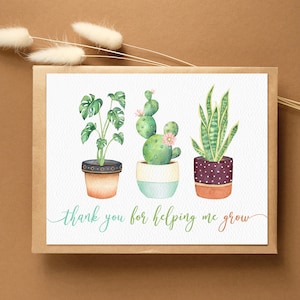 May include: A greeting card with a watercolor illustration of three potted plants. The plants are a cactus, a snake plant, and a monstera. The card has the text "thank you for helping me grow".