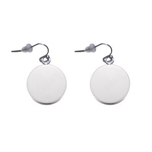 May include: A pair of silver dangle earrings with round, smooth, silver discs. The earrings have a simple, minimalist design.
