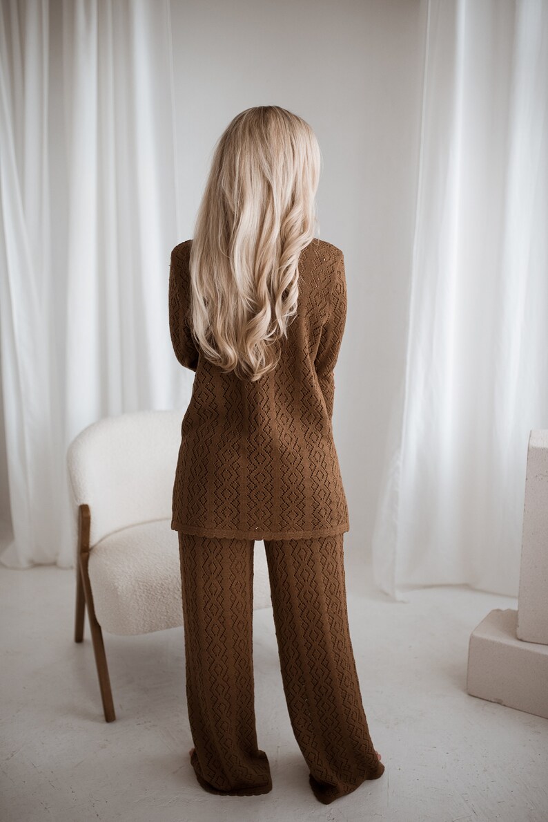 knitted merino wool brown lace suit and pants for formal, office or smart casual look. Handmade in Lithuania. A blond lady wearing the set.