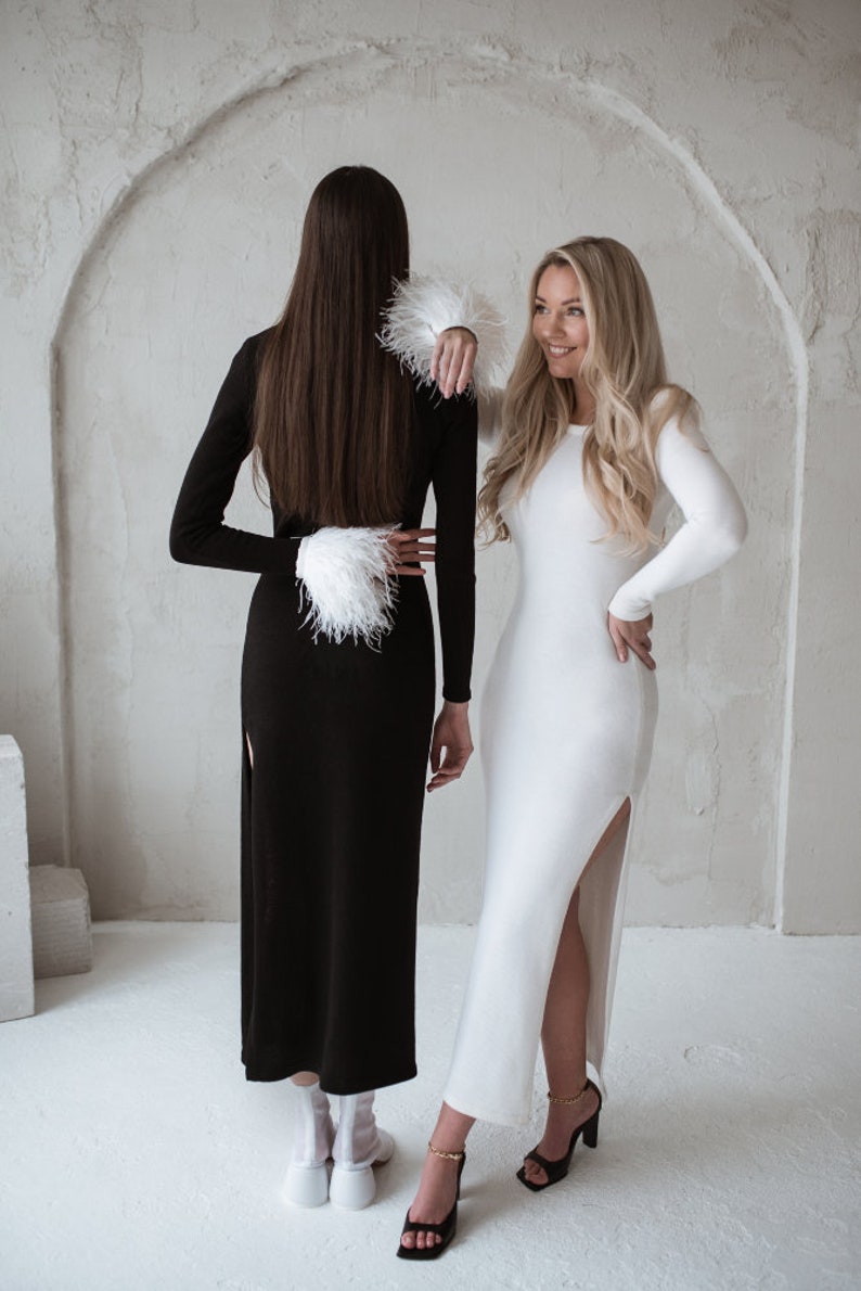 Two dresses in black and white merino wool
