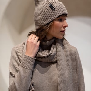 A timeless, elegant knitted scarf and a hat. Stylish and practical.