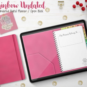 Puede incluir: Un conjunto de planificador digital y cuaderno rosa. El planificador digital está abierto, mostrando una página blanca con el texto "This Planner Belongs To". El cuaderno está cerrado con una cinta adjunta. El texto "Rainbow Undated" está en la parte superior.