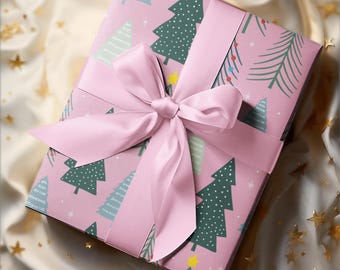 May include: A pink gift box with a pink satin bow. The box is wrapped in paper with a pattern of green and blue Christmas trees.