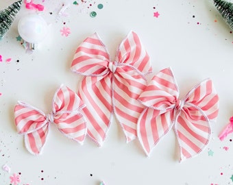 Christmas bows, Pink Stripe, holiday bows, girl bows, baby bows, nylon headband bows, serged edge bows, fable bow, pinwheel bow