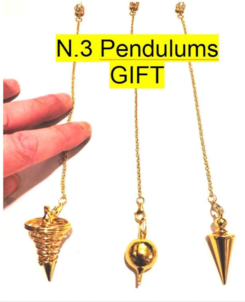 May include: Three gold-colored pendulums with different tip designs, suspended from delicate chains. The image includes the text "N.3 Pendulums GIFT" in a yellow box. The pendulums are displayed against a white background.
