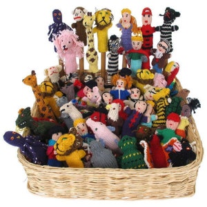 May include: A wicker basket filled with a variety of colorful knitted finger puppets. The puppets depict animals, people, and other whimsical characters.
