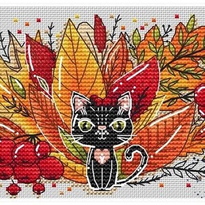 May include: A black cat with green eyes sits in a pile of colorful autumn leaves. The leaves are red, orange, and yellow. There are also red berries in the image. The cat has a pink heart on its chest. The image is a cross-stitch pattern.