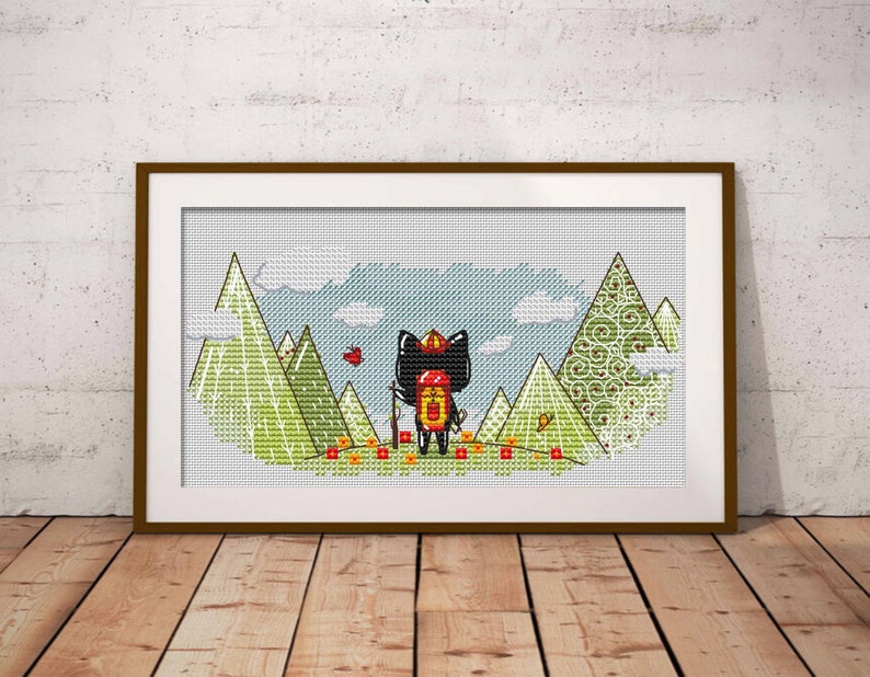 May include: Cross-stitch pattern featuring a black cat wearing a red hat and backpack, standing in a green field with mountains in the background.