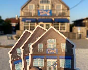 May include: Three sticker sheets featuring a cartoon illustration of a coffee shop building with a blue awning and the text "How You Brewin?" above the entrance. The building has a balcony and the text "Coffee Bar" is visible on the side. A blue banner with the word "Open" hangs from the building.