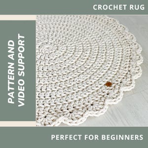 May include: A cream-colored, round crochet rug with a scalloped edge. The rug is made of thick, looped yarn and features the text "CROCHET RUG", "PATTERN AND VIDEO SUPPORT", and "PERFECT FOR BEGINNERS".