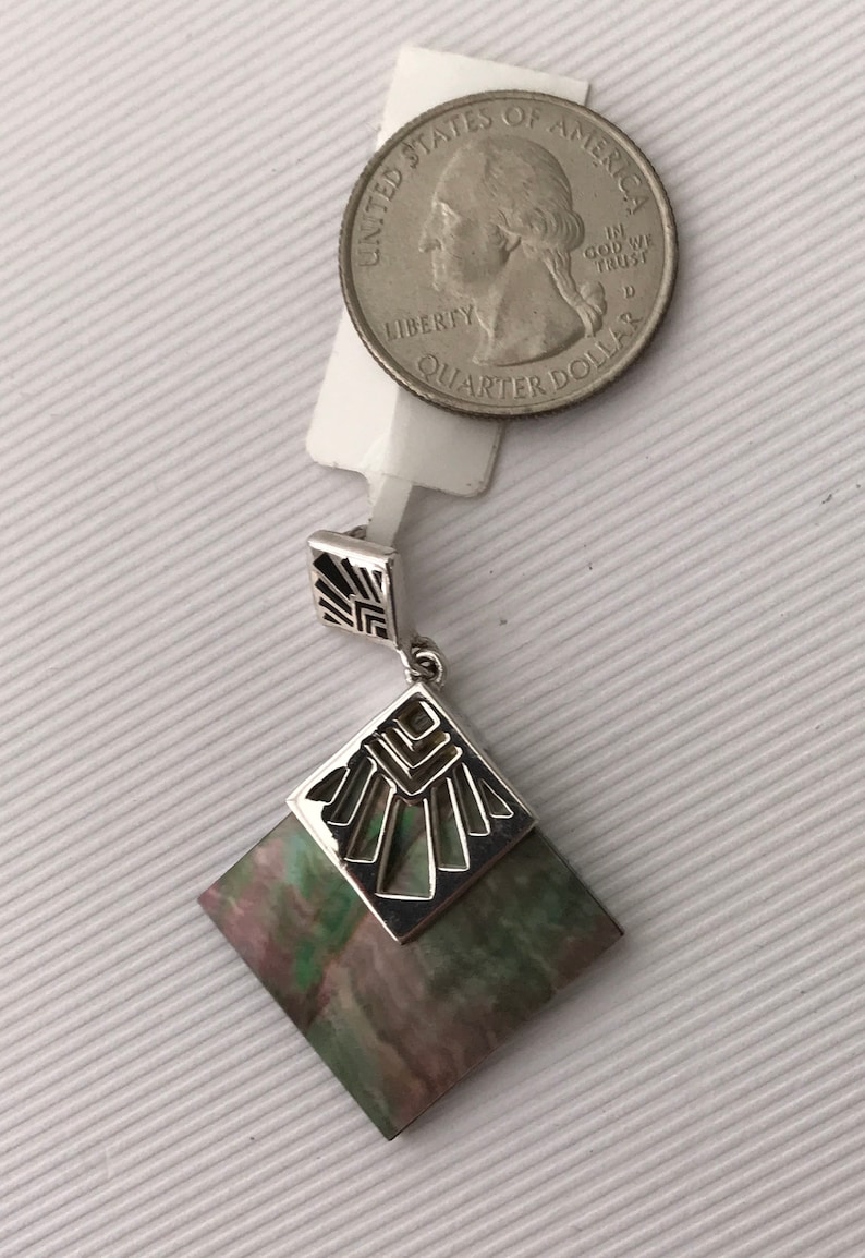 Tahitian Mother of Pearl Pendant with Polynesian Motifs