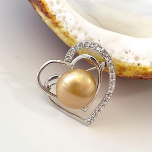 True Baroque shape 13.5mm Golden South Sea Cultured Pearl Brooch with White Topaz accent