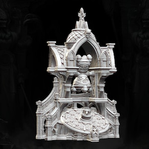 May include: A white, detailed, miniature, 3D printed model of a gothic-style tower with a round, ornate, decorative top. The tower has a round, decorative base with a circular, detailed design.
